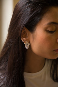 <p>Introducing Hana Studs. Each piece features a delicate flower shape embedded with shimmering cubic zirconia, exuding a sparkle that catches the eye. Adorned with an imitation pearl to add sophistication and grace.</p> <p>Perfect for parties and special events, these studs are just stunning and a game changer. Whether you're dancing the night away or mingling with friends, these studs are sure to make a statement and leave a lasting impression</p>