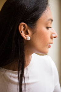 You can never go wrong with pearls. Our 14mm imitation pearl studs are a must have accessory that you need to add to your collection. Easily transforms from day to night look without ever disappointing. A simple choice to look and feel great.