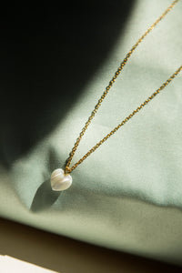 - Stainless Steel, Gold Plated

Add a touch of elegance to your everyday style with Eva Necklace, featuring a beautifully crafted heart-shaped white natural stone. This minimalistic and cute necklace is perfect for those who love subtle, yet meaningful jewelry that can be worn daily.