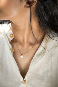 - Stainless Steel, PVD Gold Plated&nbsp;, Cubic Zirconia

- Hypoallergenic &amp; Tarnish Resistant

Add a touch of elegance to your everyday style with Eva Necklace, featuring a beautifully crafted heart-shaped white natural stone. This minimalistic and cute necklace is perfect for those who love subtle, yet meaningful jewelry that can be worn daily.