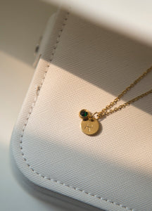 Discover the elegance of personalized jewelry with our Initial Necklace. This beautiful necklace features a round disc pendant with a hand-stamped initial of your choice, subtly hidden behind a sparkling charm. Delicate gold plated link chain adds so much beauty to this necklace. The charm comes in four gorgeous colors to match your unique style. It can be a thoughtful and unique gift for your loved ones and you.